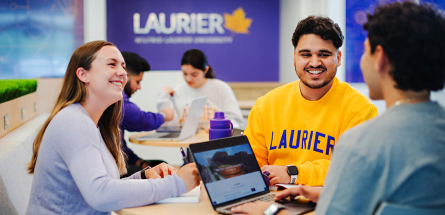 Milton students chatting in community space