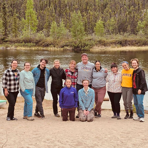 Laurier staff standing on a beach in the Northwest Territories