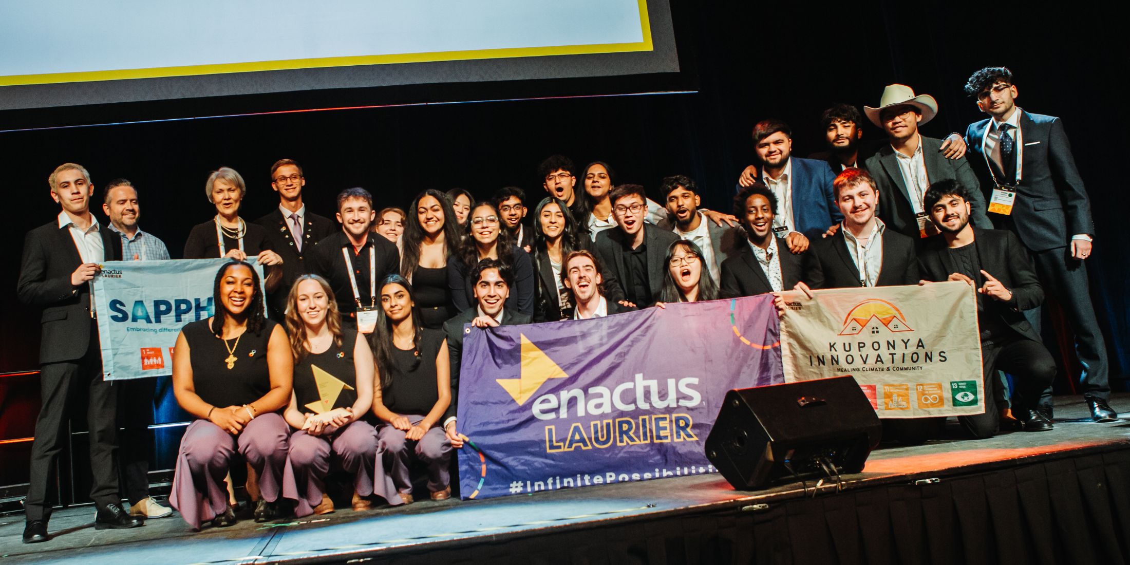 Laurier's Enactus team on a stage.