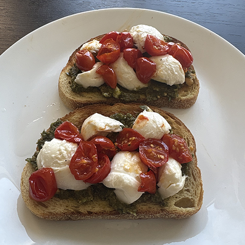 Toast with tomatoes and mozzarella balls