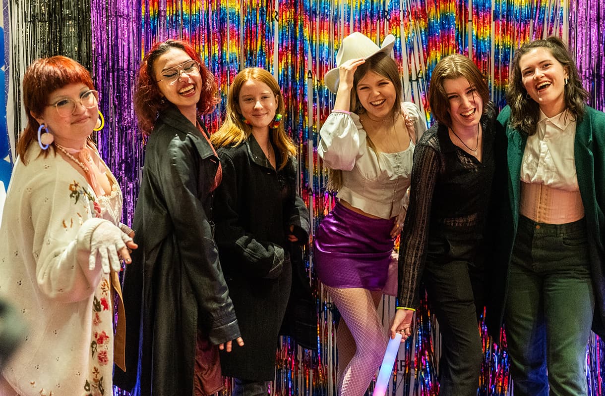 Students posing at Winter's a Drag event