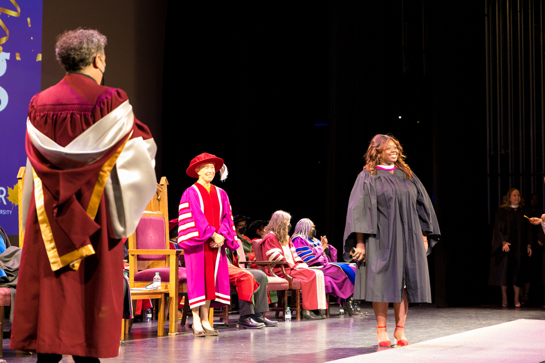 Graduates cross the stage