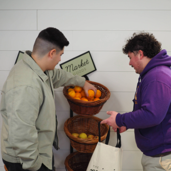 Students select fruit items at the Waterloo mini market