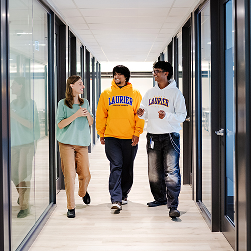 Staff and students in hallway