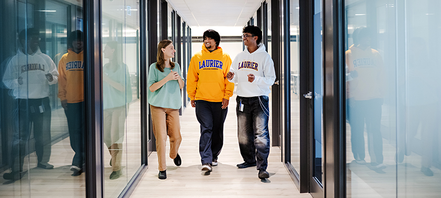 Staff and students in hallway