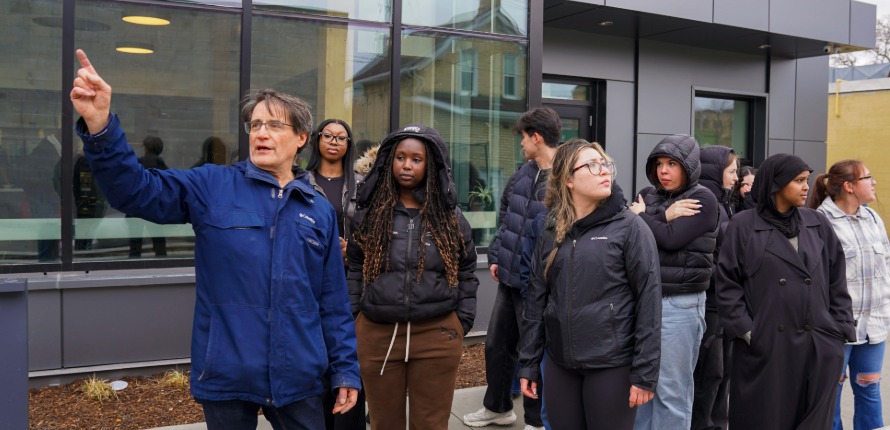Mancini and students in the courtyard of The Working Centre's 97 Victoria St. N. campus