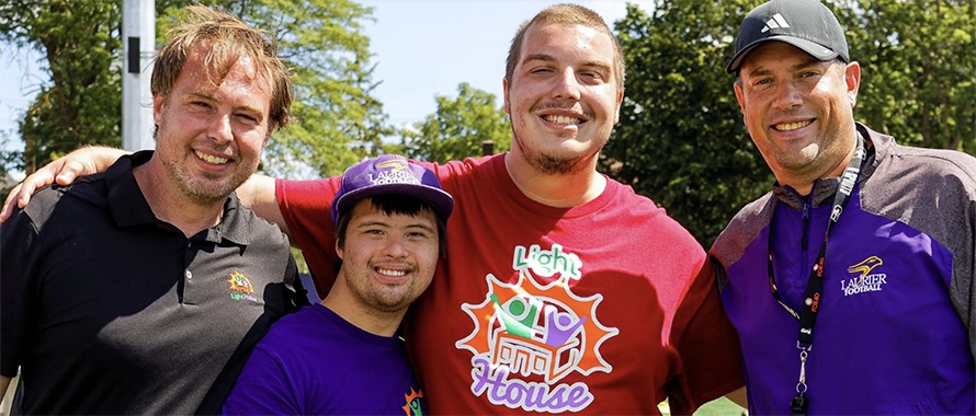 Laurier football coach with program participants