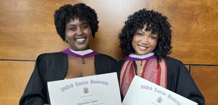 Timna Habta and Mialy Rakotoharilala in convocation gowns.