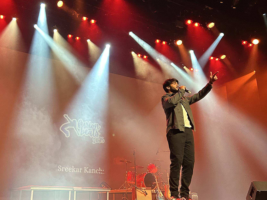 Young man singing on stage at Sanderson Centre