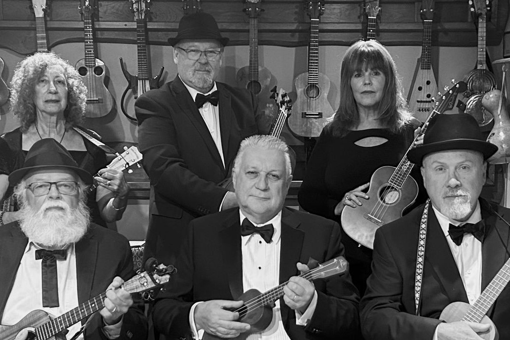 Six members of the Sonic Uke Ensemble pose with their instruments
